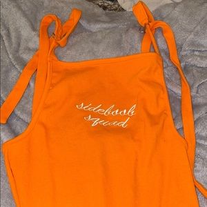 Neon orange side boob squad slogan bodysuit